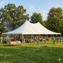 Outdoor wedding tent rental setup in Pittsburgh PA with string lights, round tables, and white folding chairs at evening reception