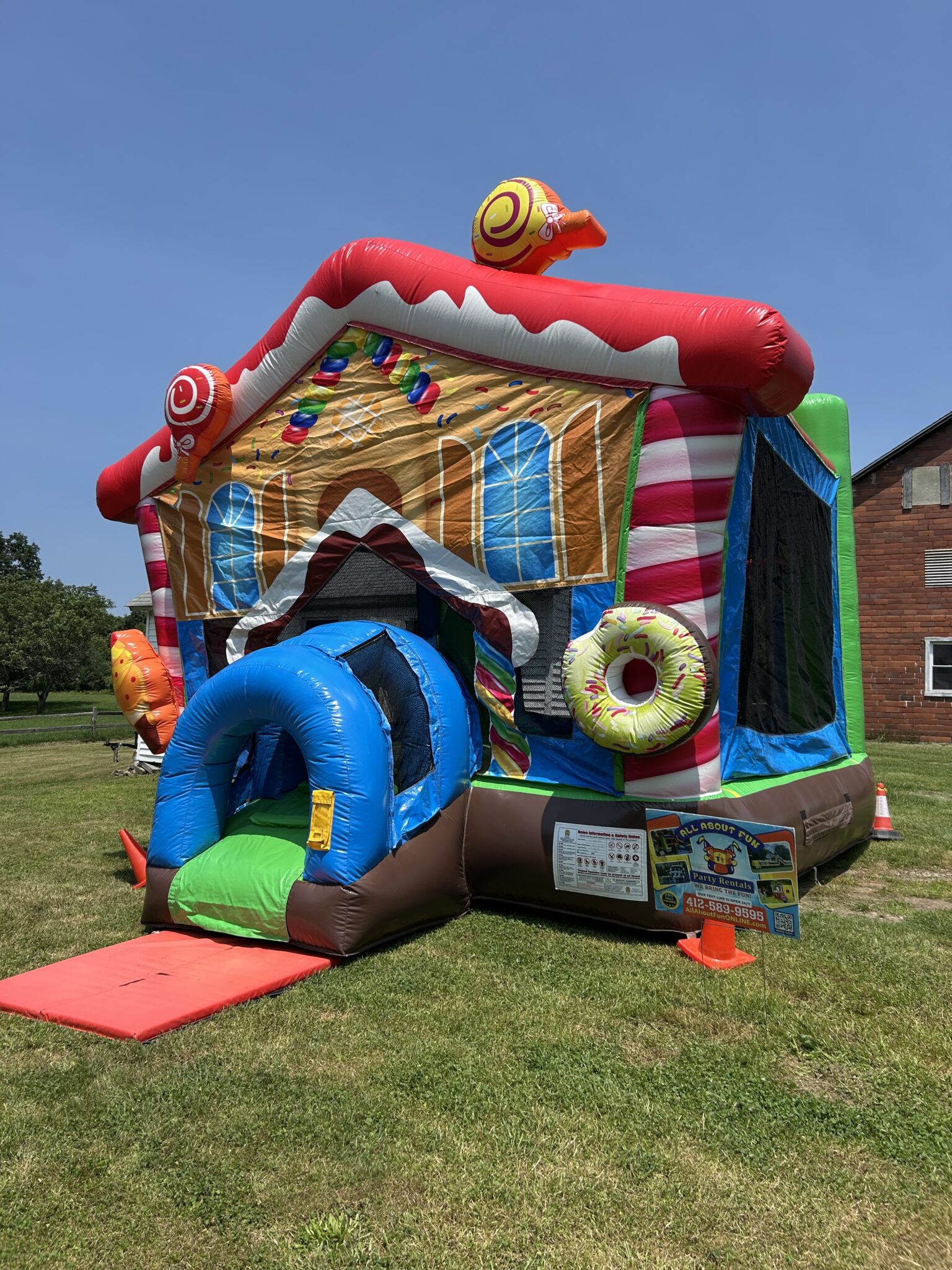 Colorful inflatable bounce house with slide and play features in Butler PA