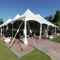 White event tent setup with tables and chairs for an outdoor celebration in Wexford, PA